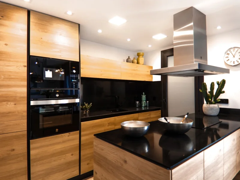 Warm cabinets in a sleek and modern kitchen