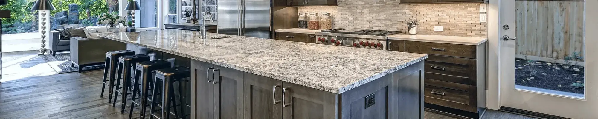 Warm wood cabinets in a modern kitchen at Willow Creek Flooring in Sauk City, WI